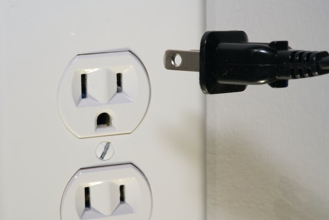 black%20plug%20going%20into%20a%20white%20outlet black%20plug%20going%20into%20a%20white%20outlet